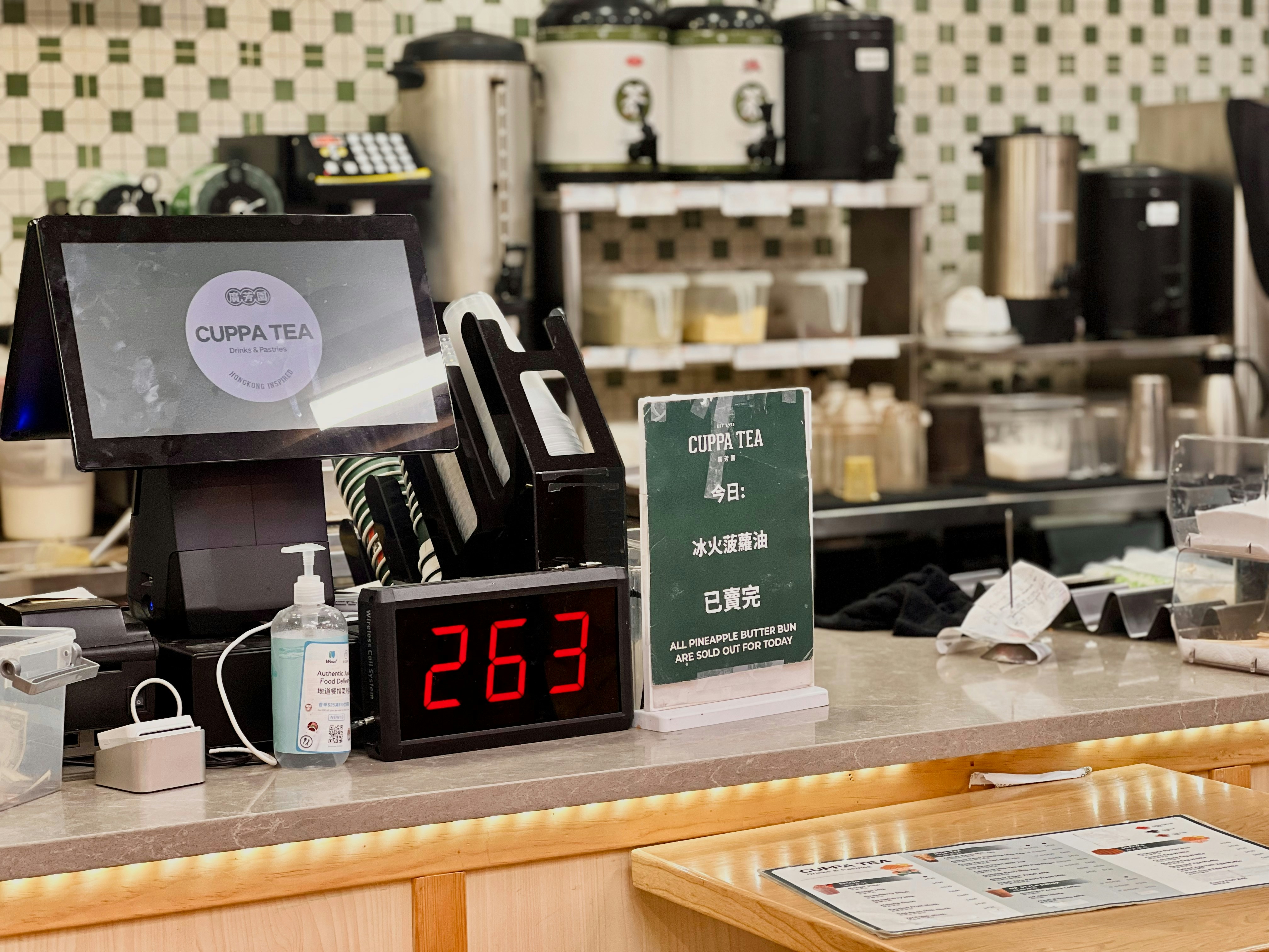 Restaurant counter with POS terminal and order display, illustrating point-of-sale hardware and front-of-house operations