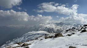 A snow covered mountain with a sky background
