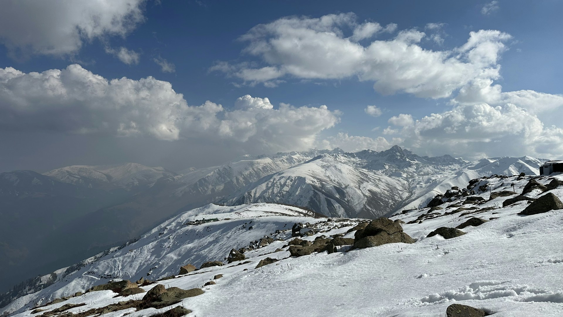 A snow covered mountain with a sky background