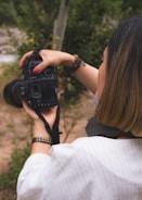 A woman taking a picture with a camera