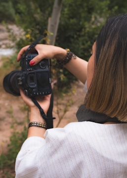 A woman taking a picture with a camera