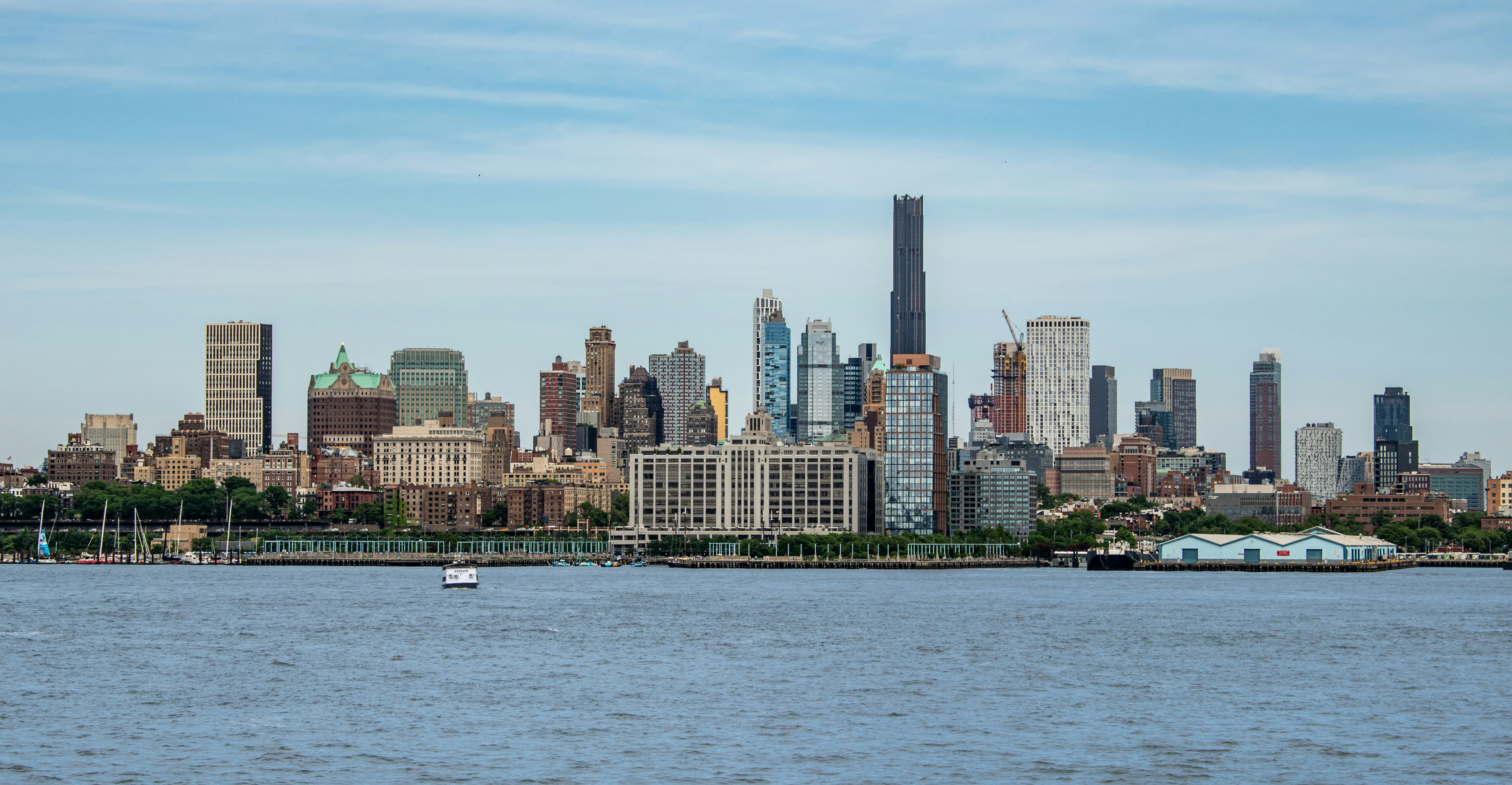 A large body of water with a city in the background