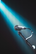 A microphone with a light shining on it