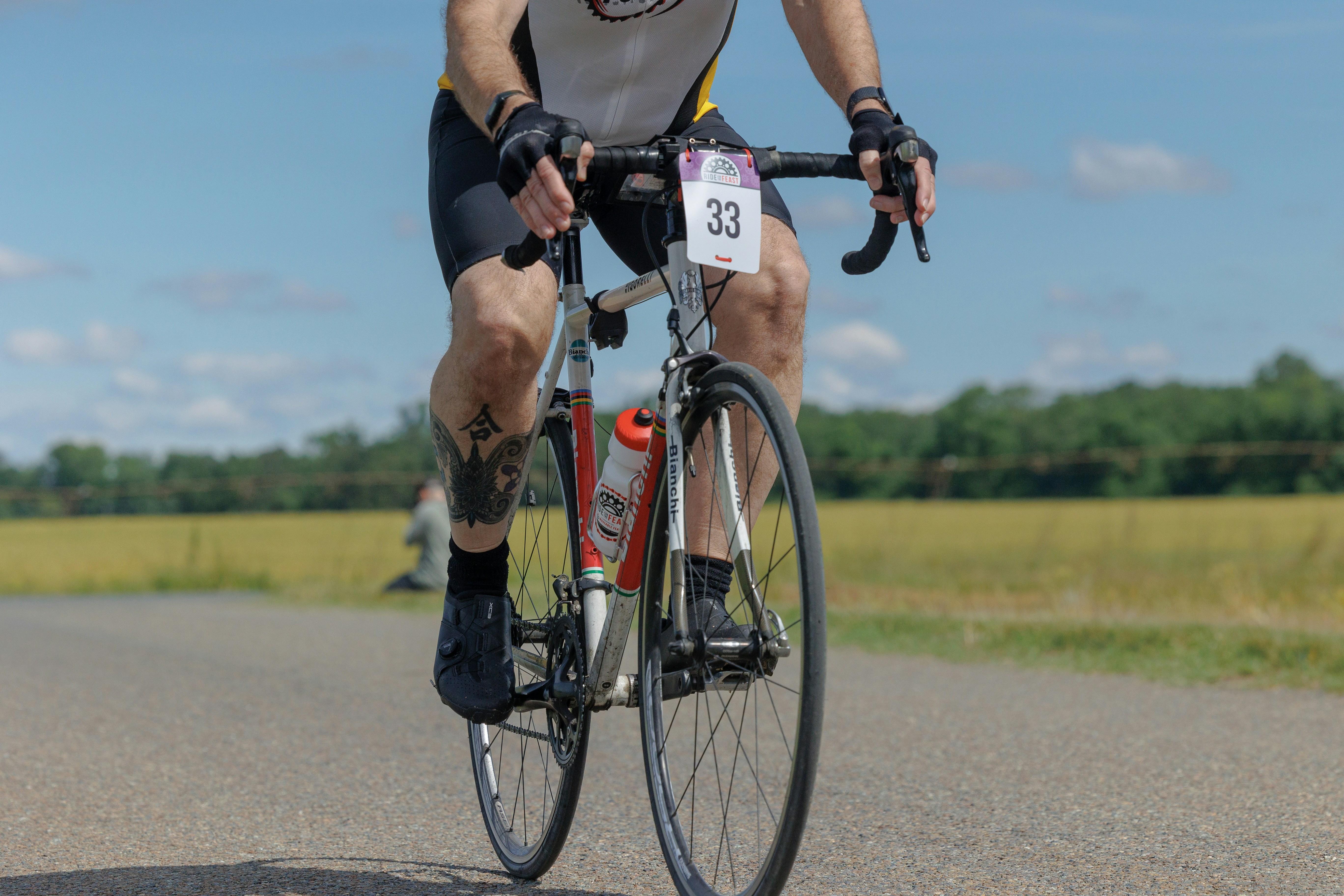 A man riding a bike down a road