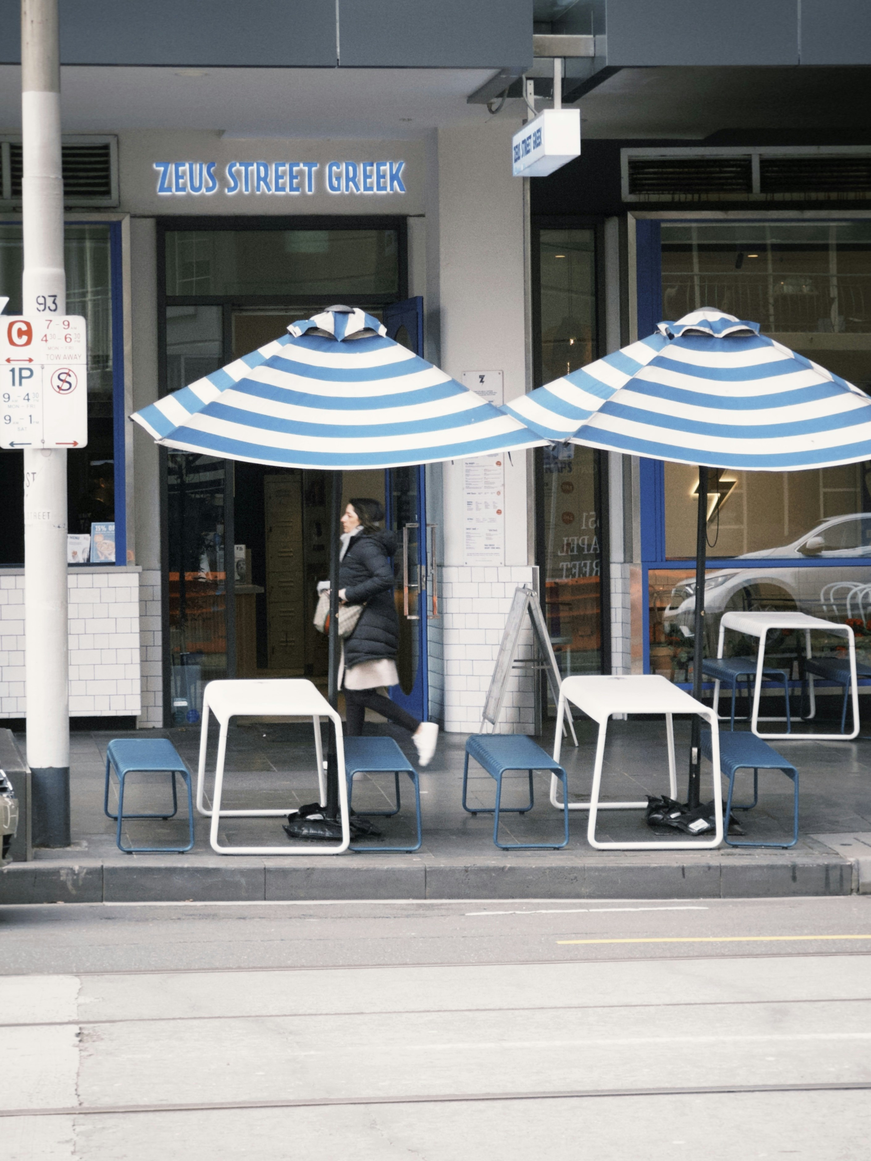 A couple of umbrellas that are outside of a building
