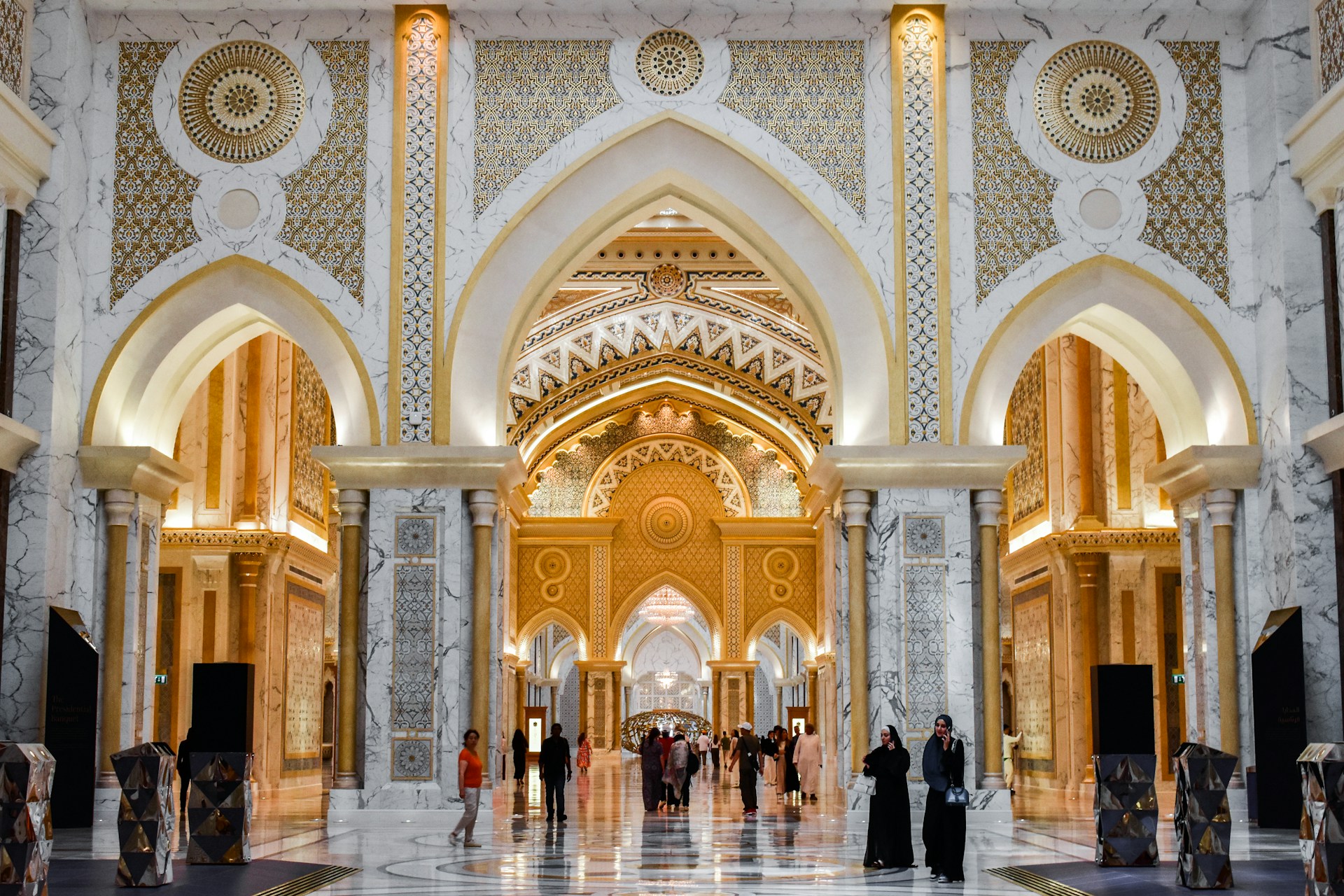 A group of people standing inside of a building
