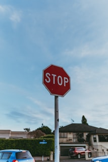 A red stop sign sitting on the side of a road