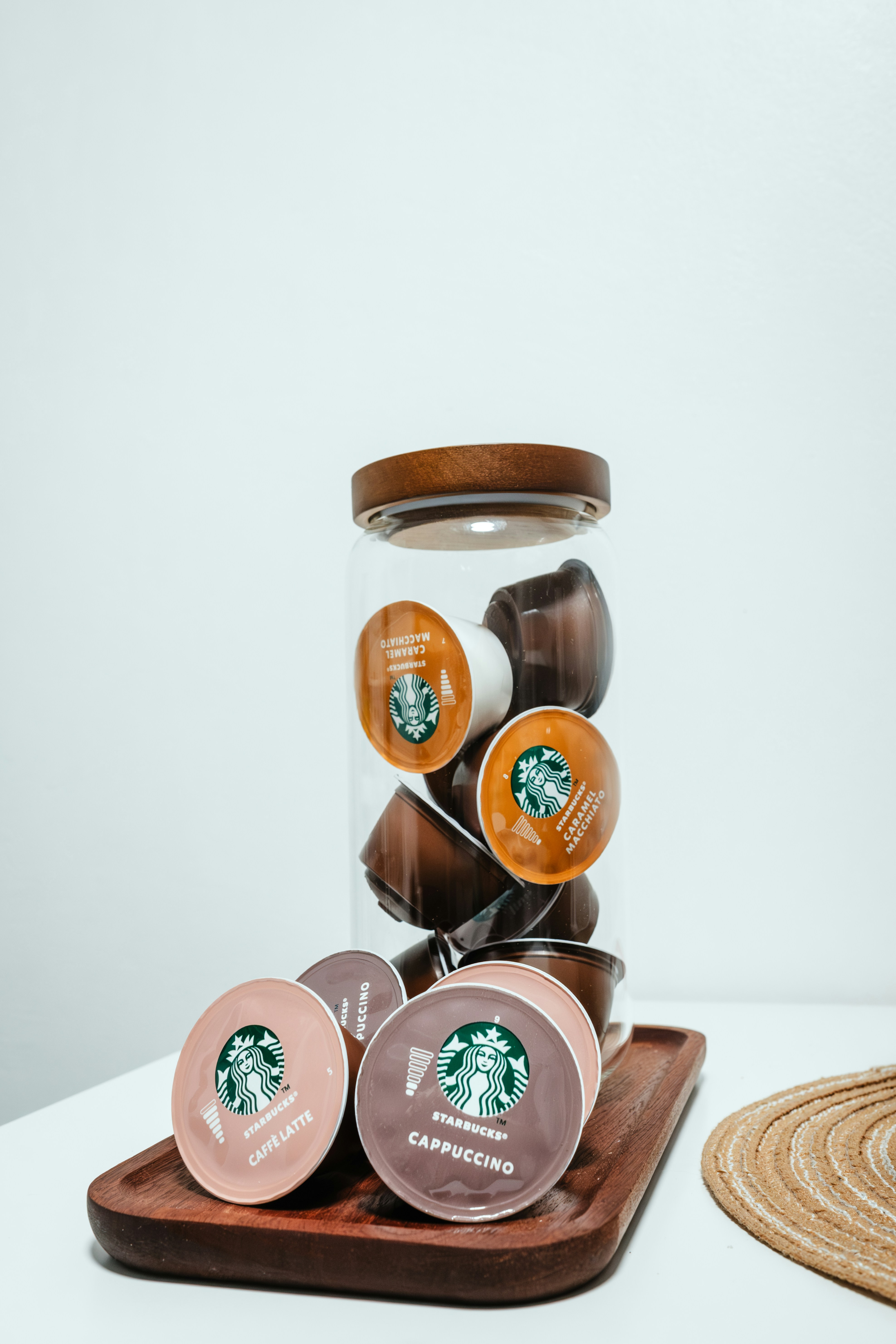 A glass jar filled with chocolate covered cookies