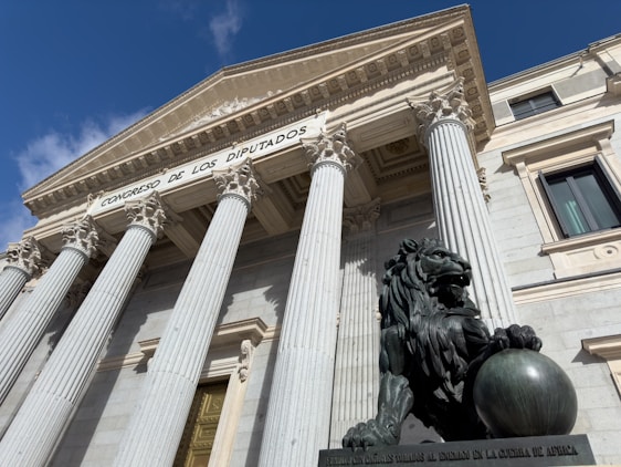 A building with columns and a statue in front of it