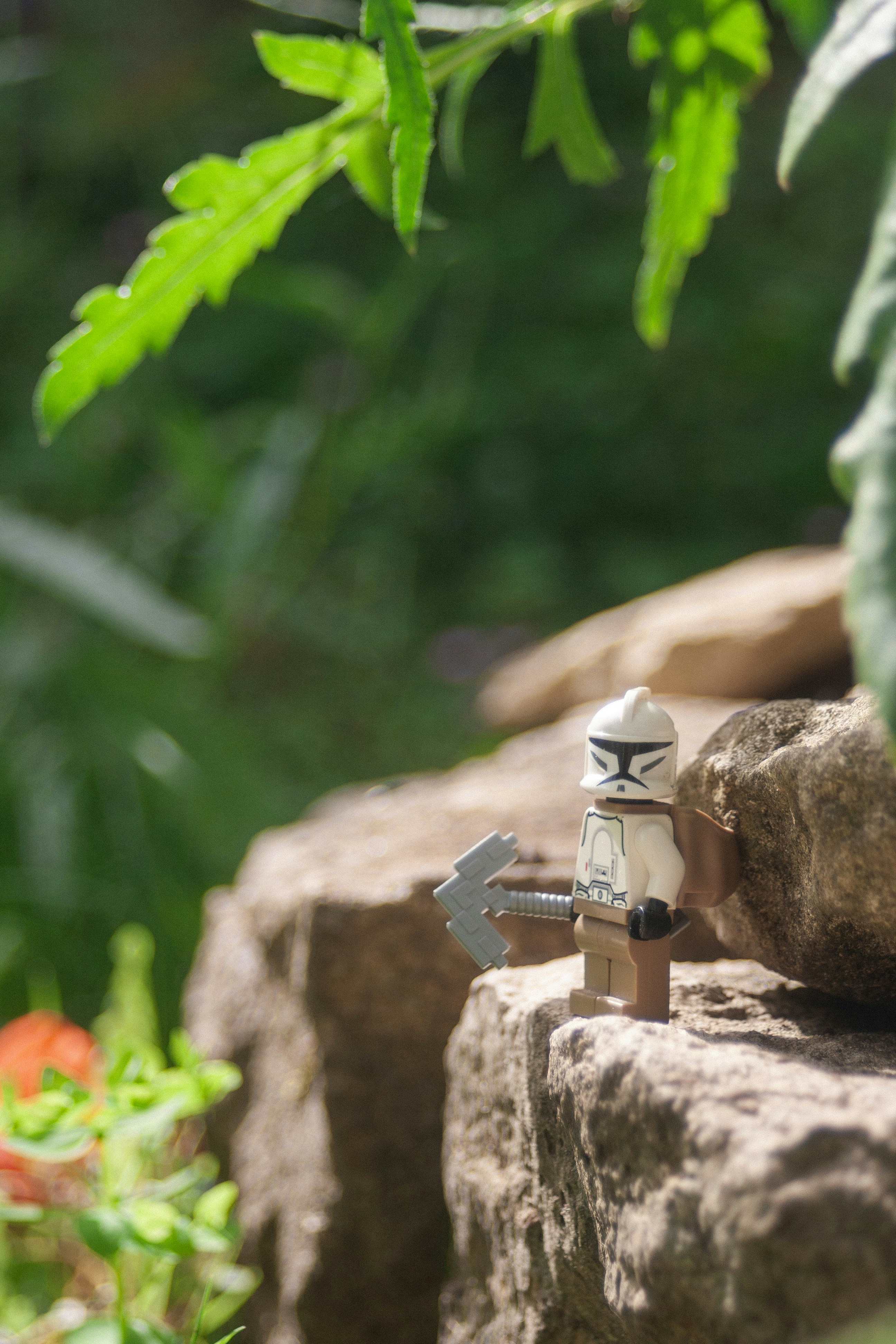 A small toy is sitting on a rock
