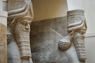 A close up of two statues of elephants