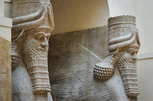 A close up of two statues of elephants