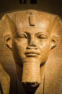 A close up of a statue of an egyptian pharaoh