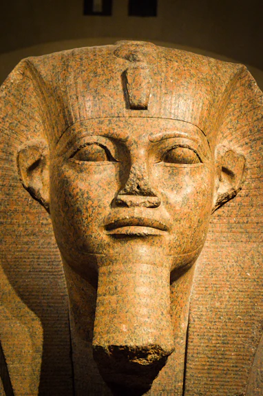 A close up of a statue of an egyptian pharaoh