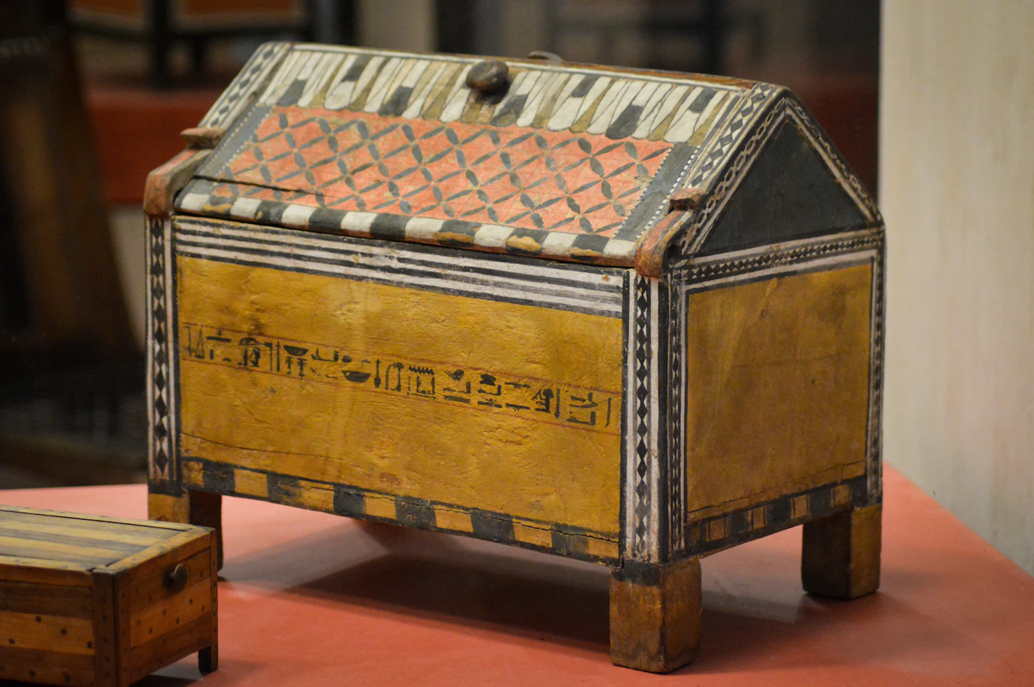 Cottage Chest: a restored inlaid cylinder music box with a pitched lid on a red cloth