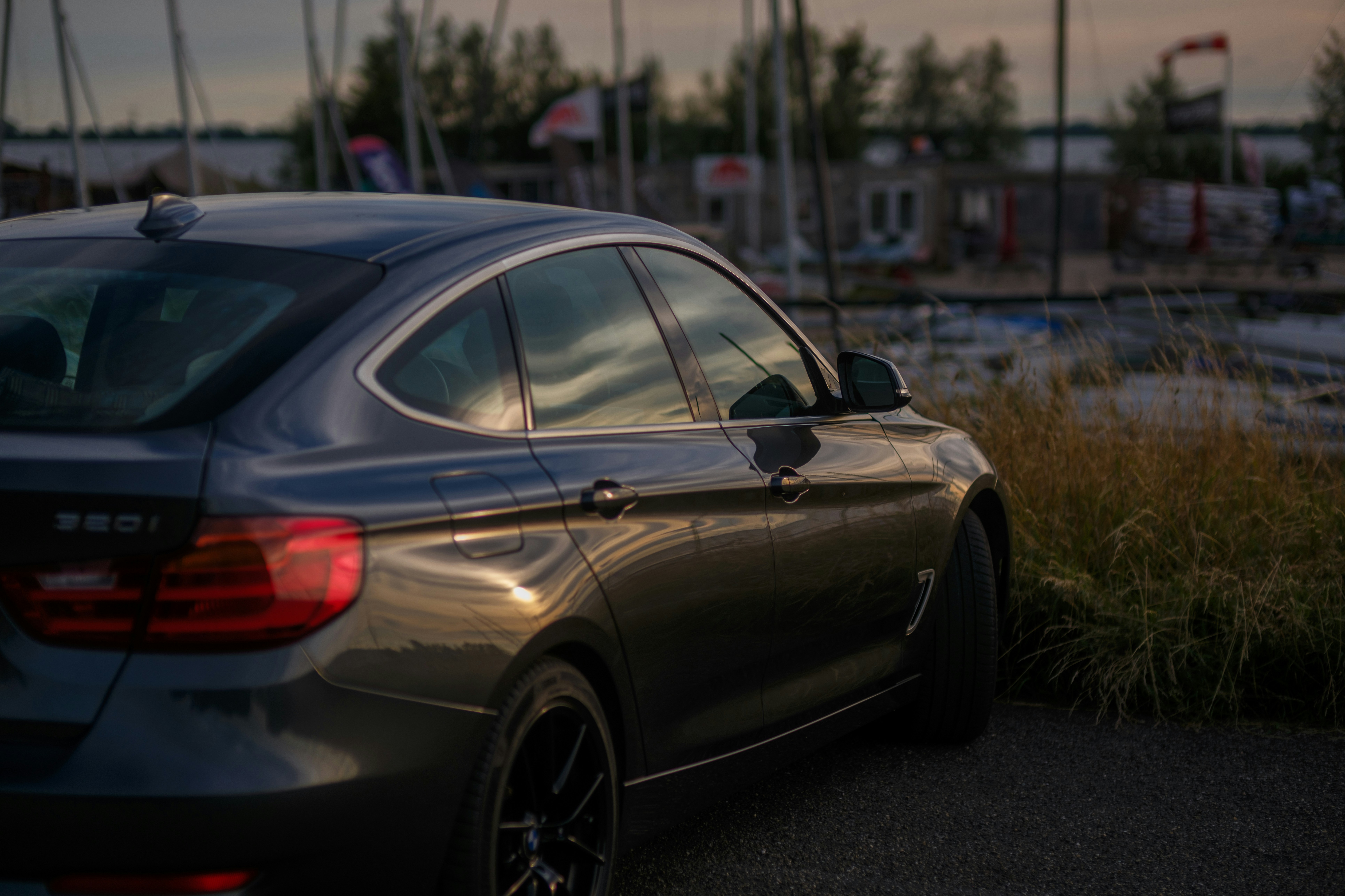 car at the marina at sunset