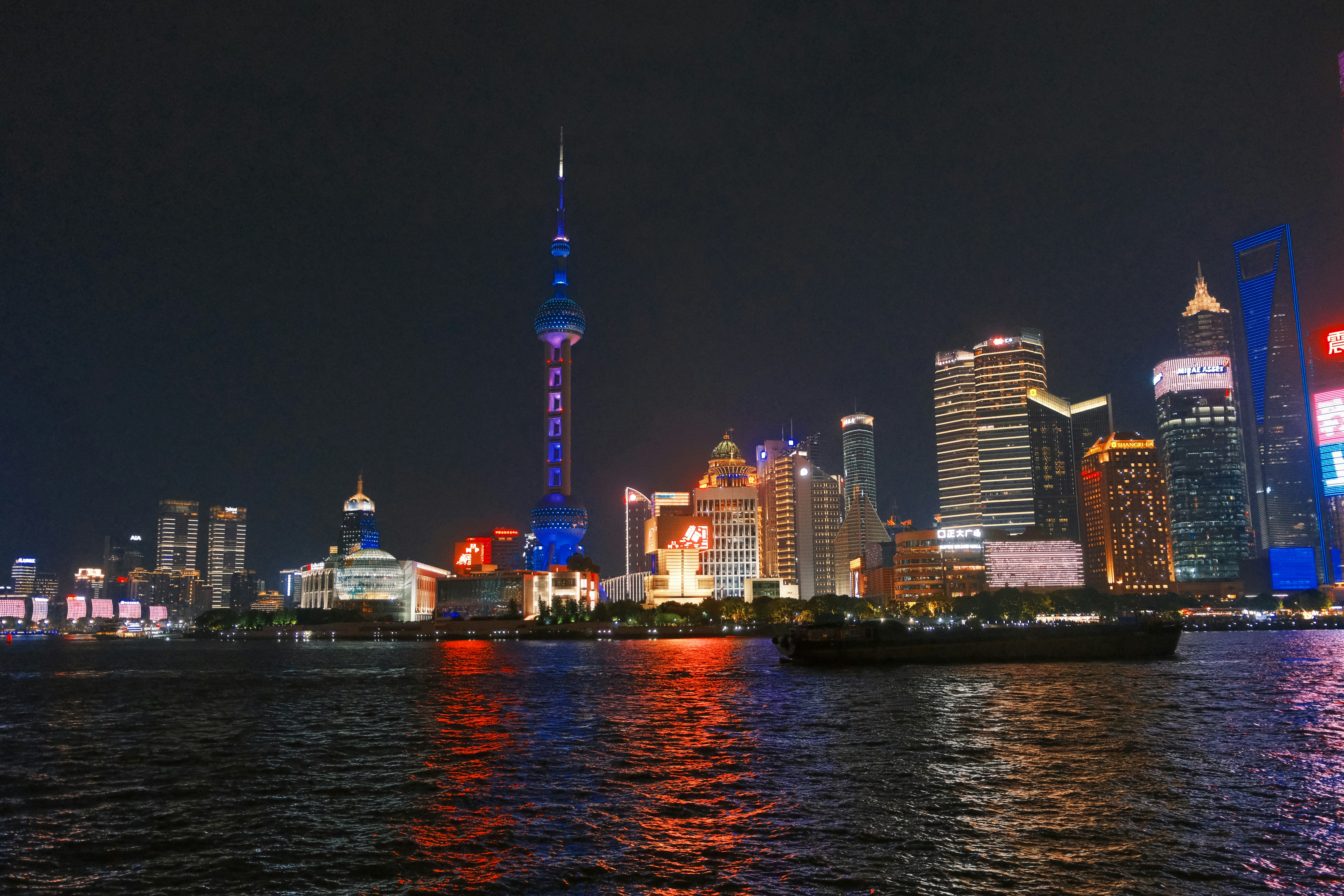A large body of water with a city in the background