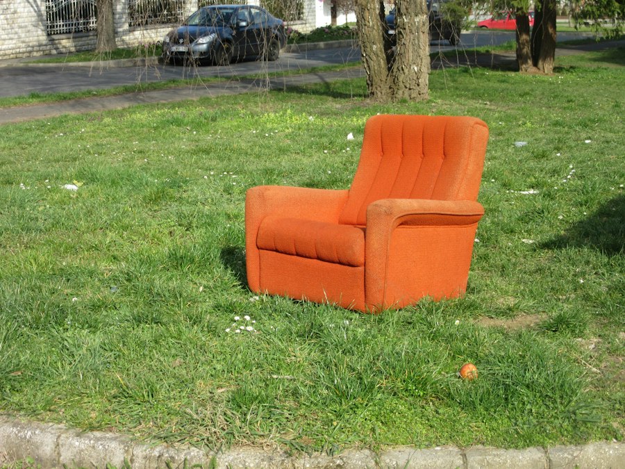 Orange lounge chair on grass