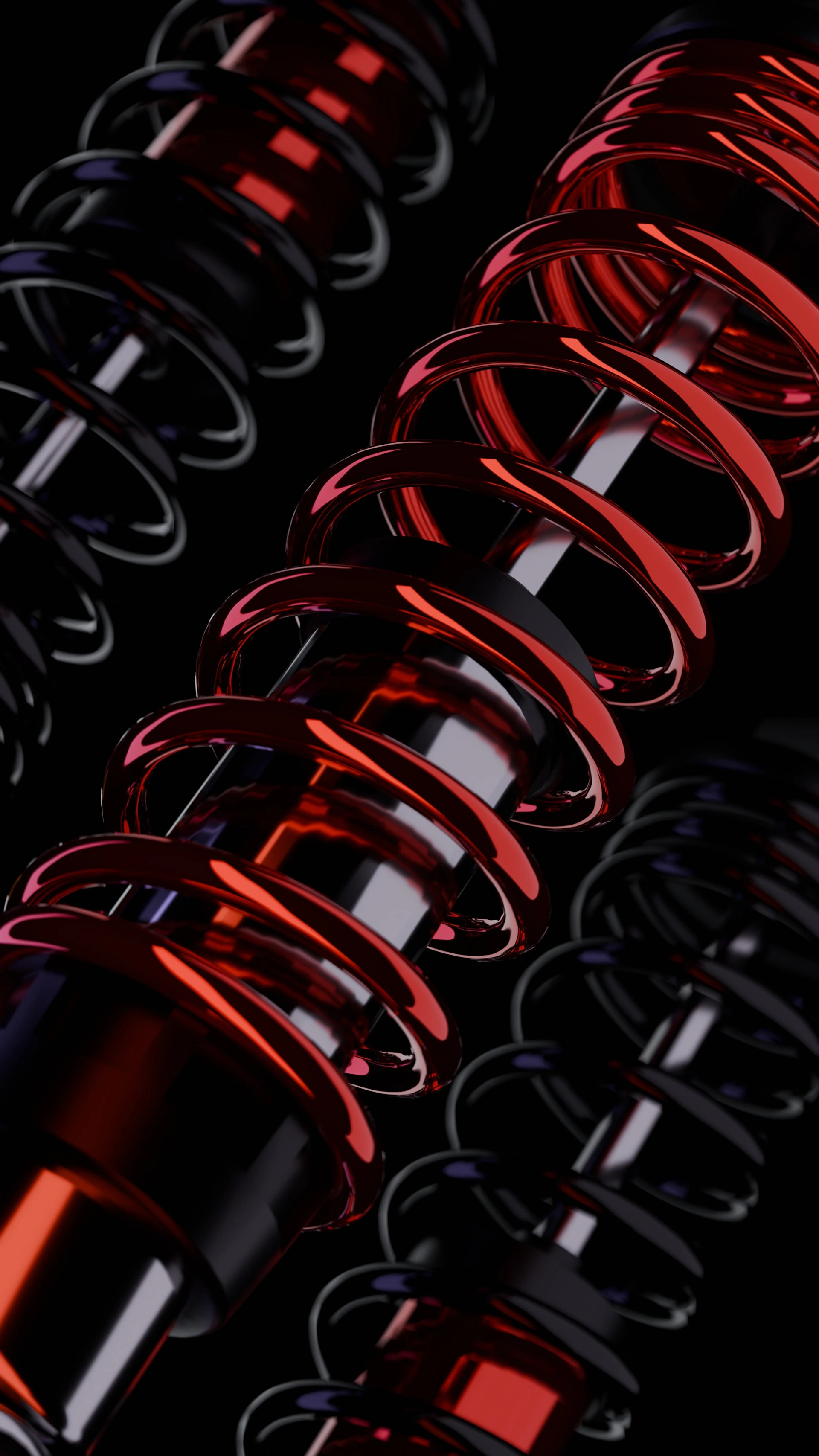 A group of red and black springs on a black background