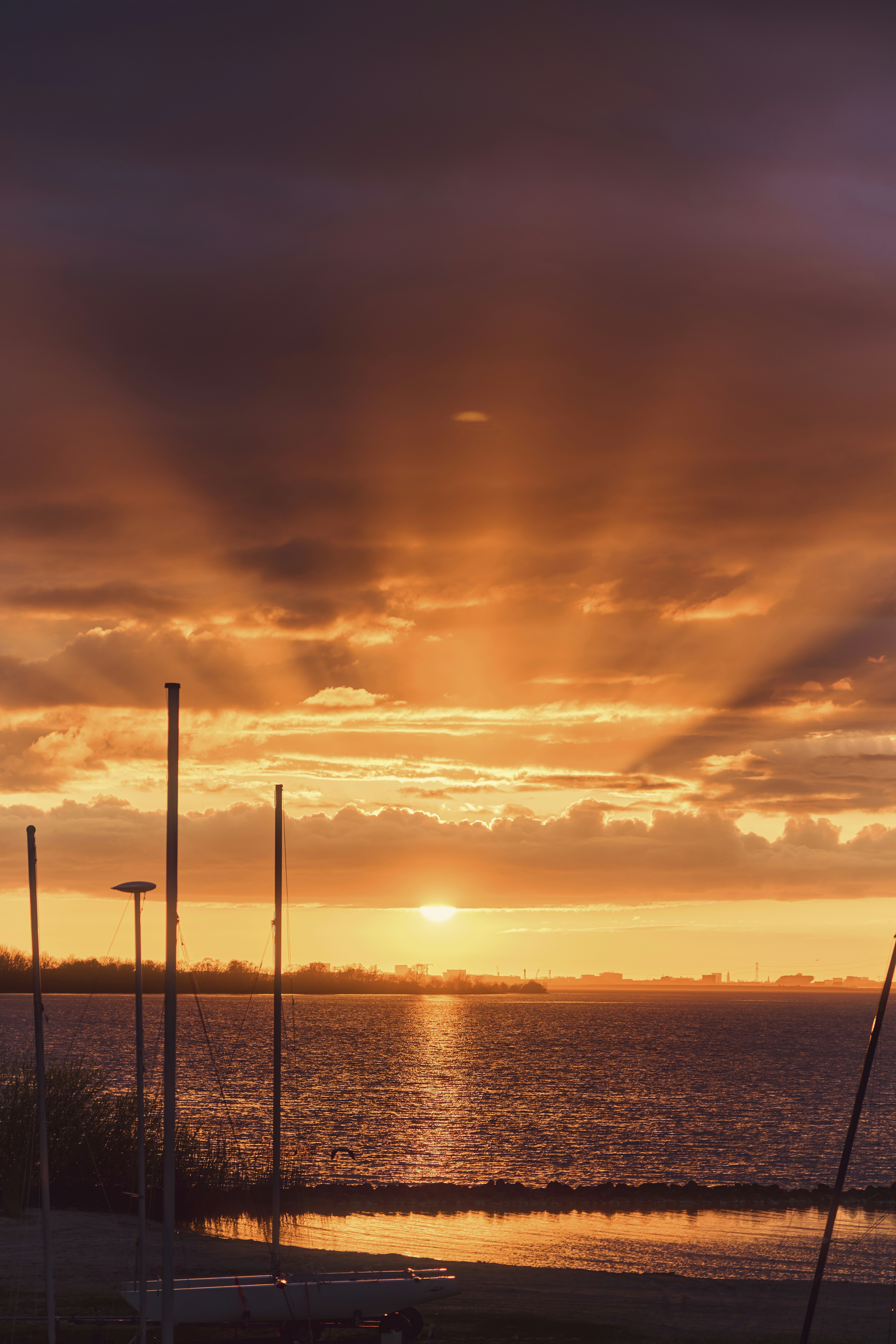 The sun is setting over a body of water