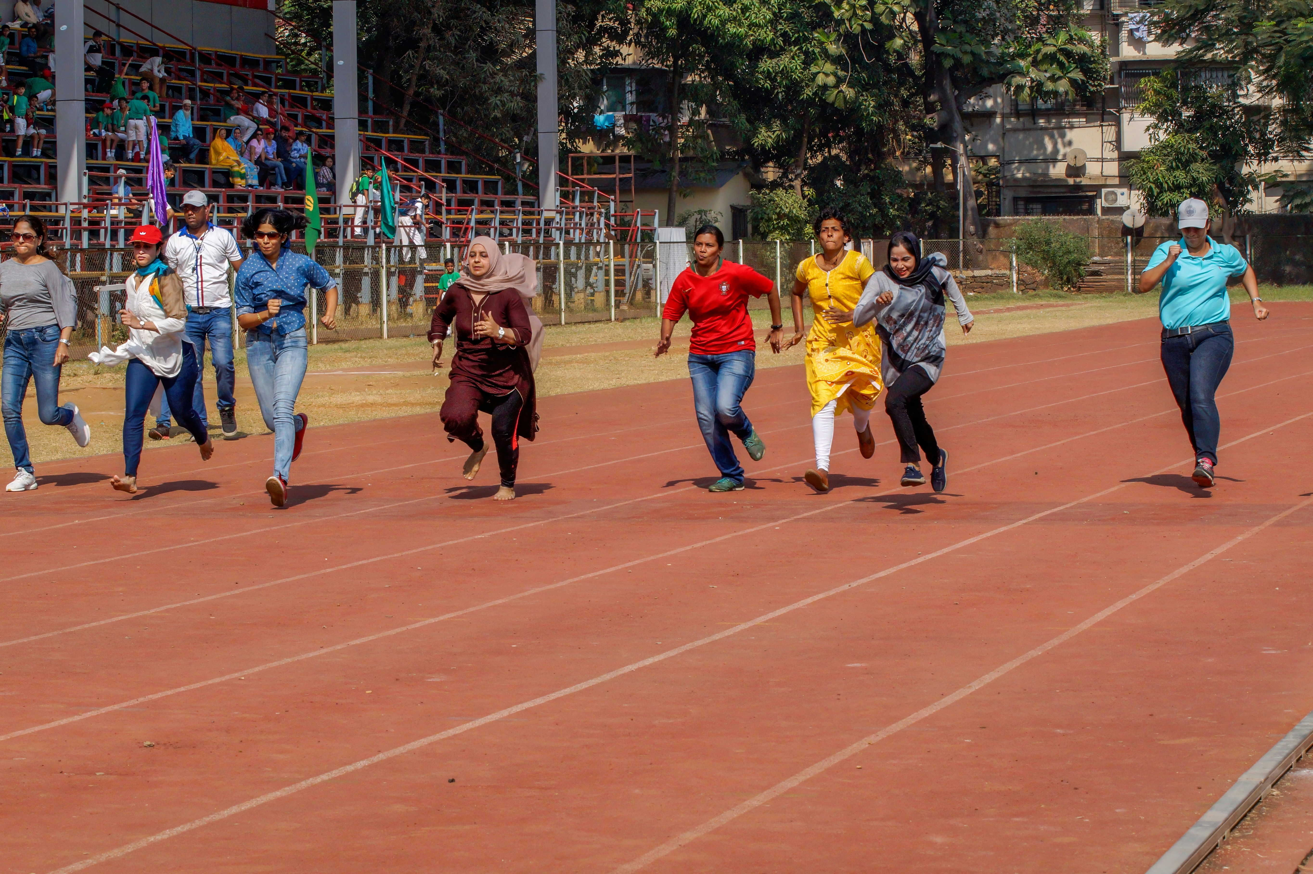 A group of people running on a track