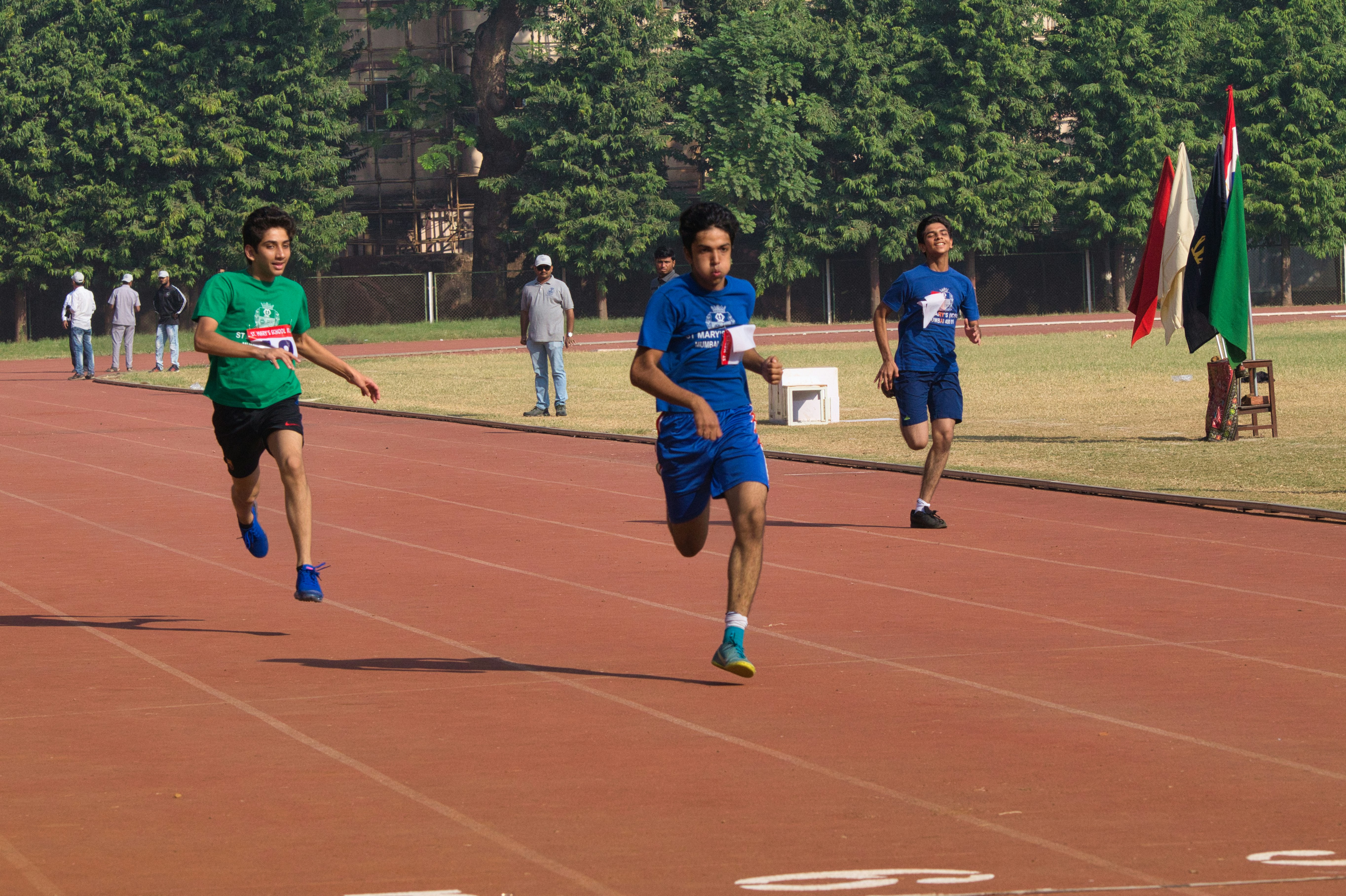 A group of young men running on a track