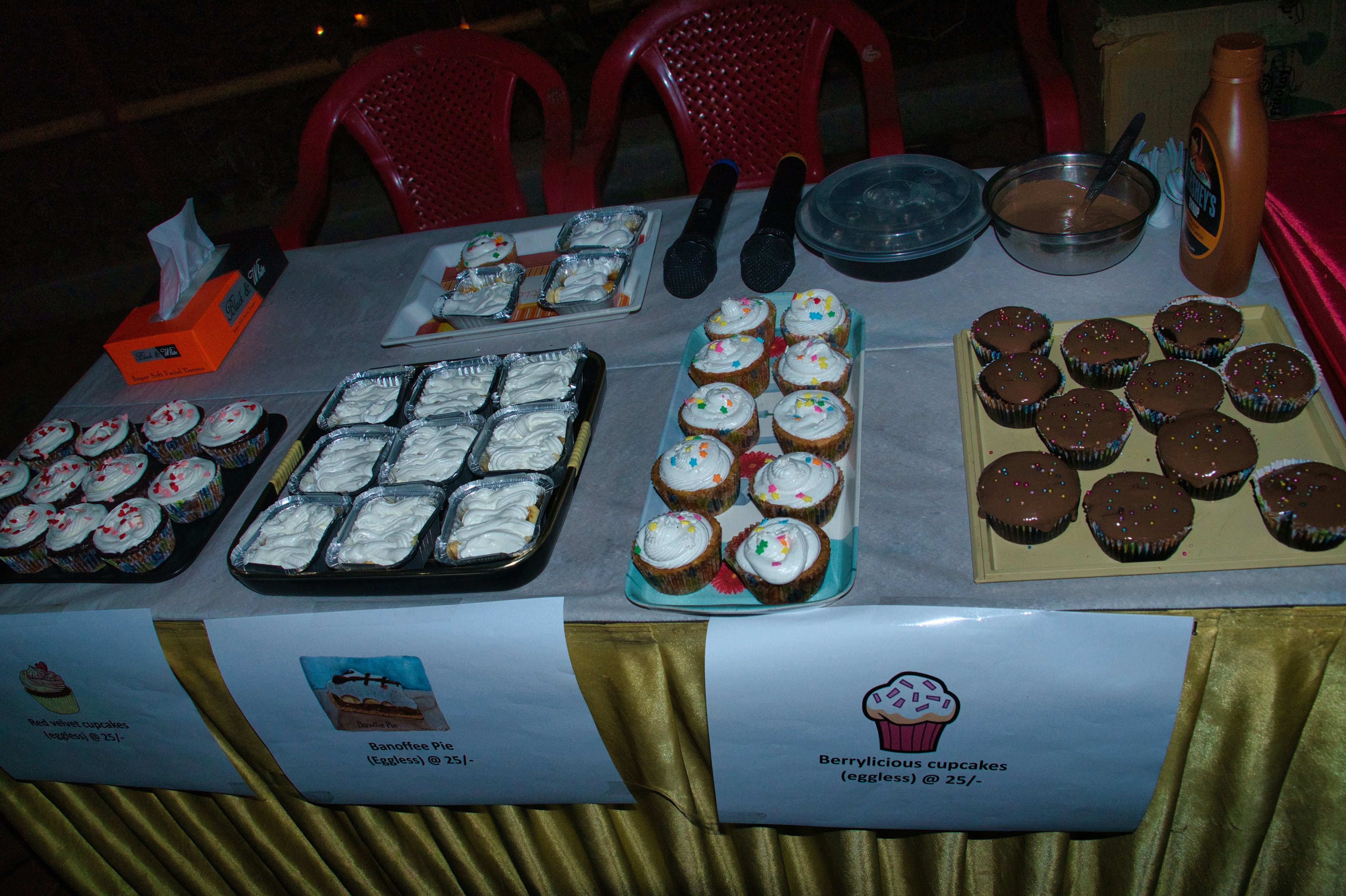 A table topped with lots of cupcakes and cakes