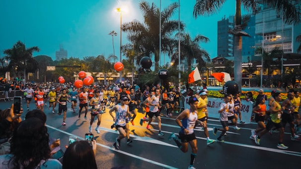 A large group of people running down a street