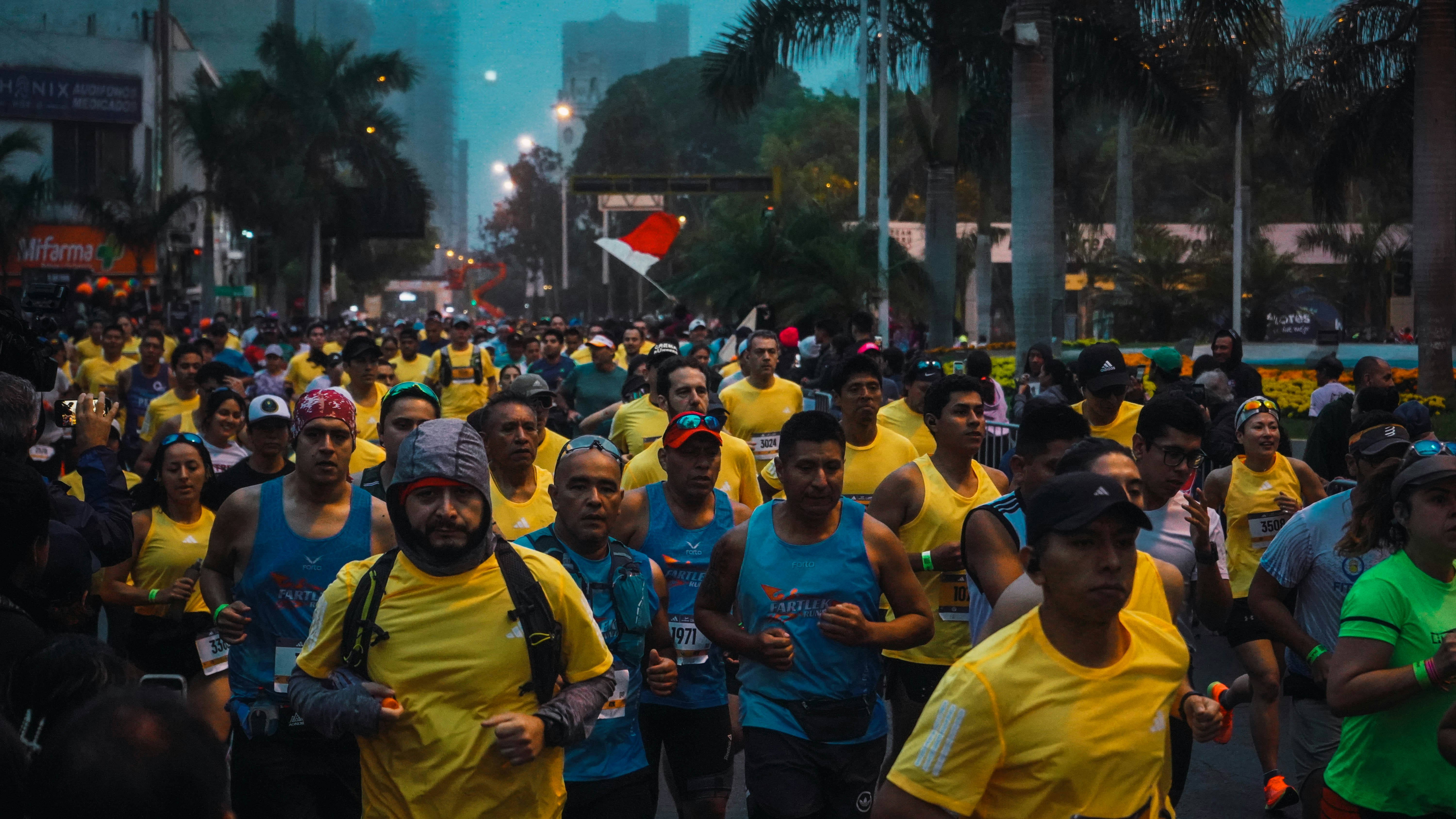 A large group of people walking down a street