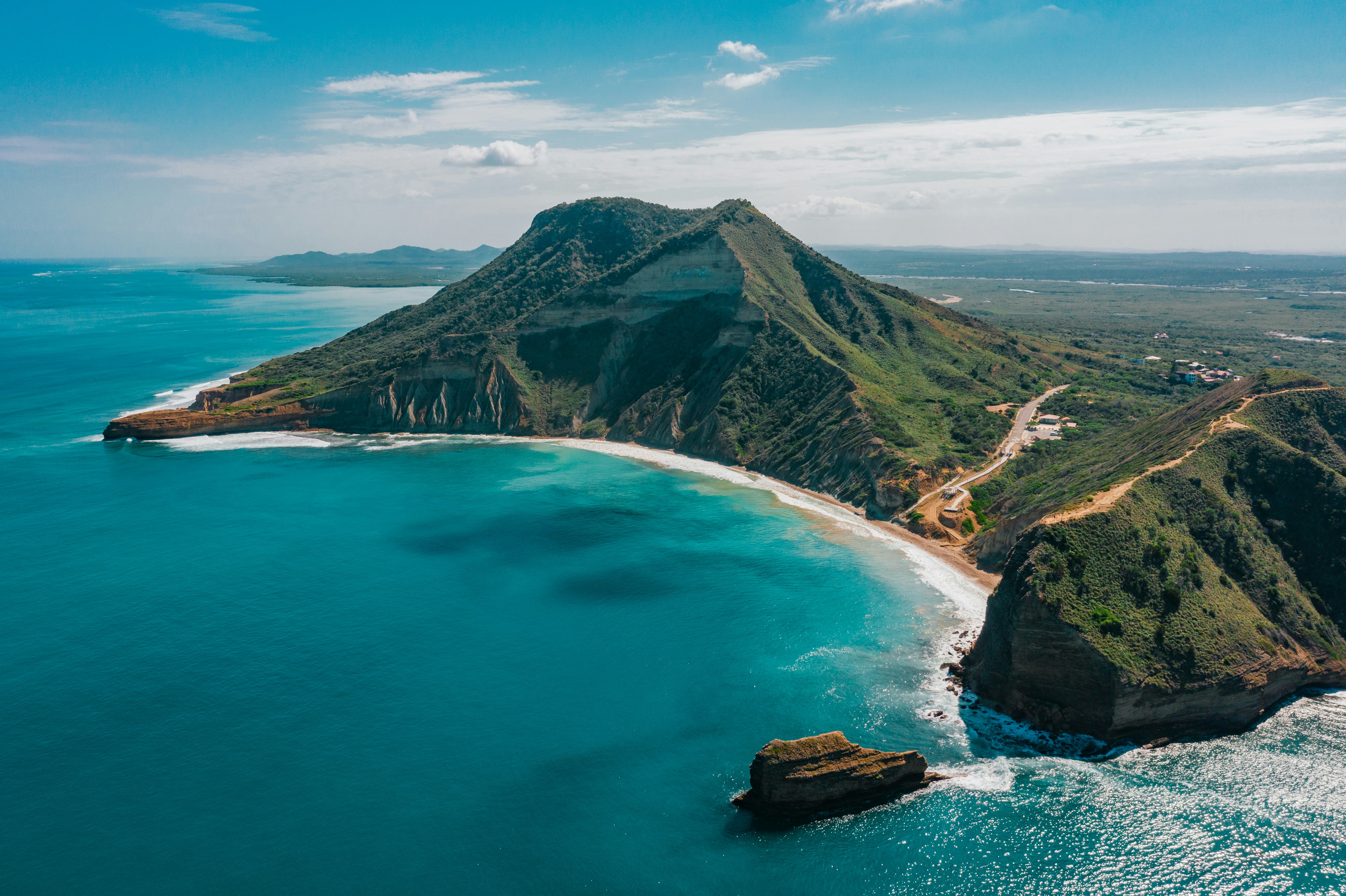 An aerial view of an island in the middle of the ocean
