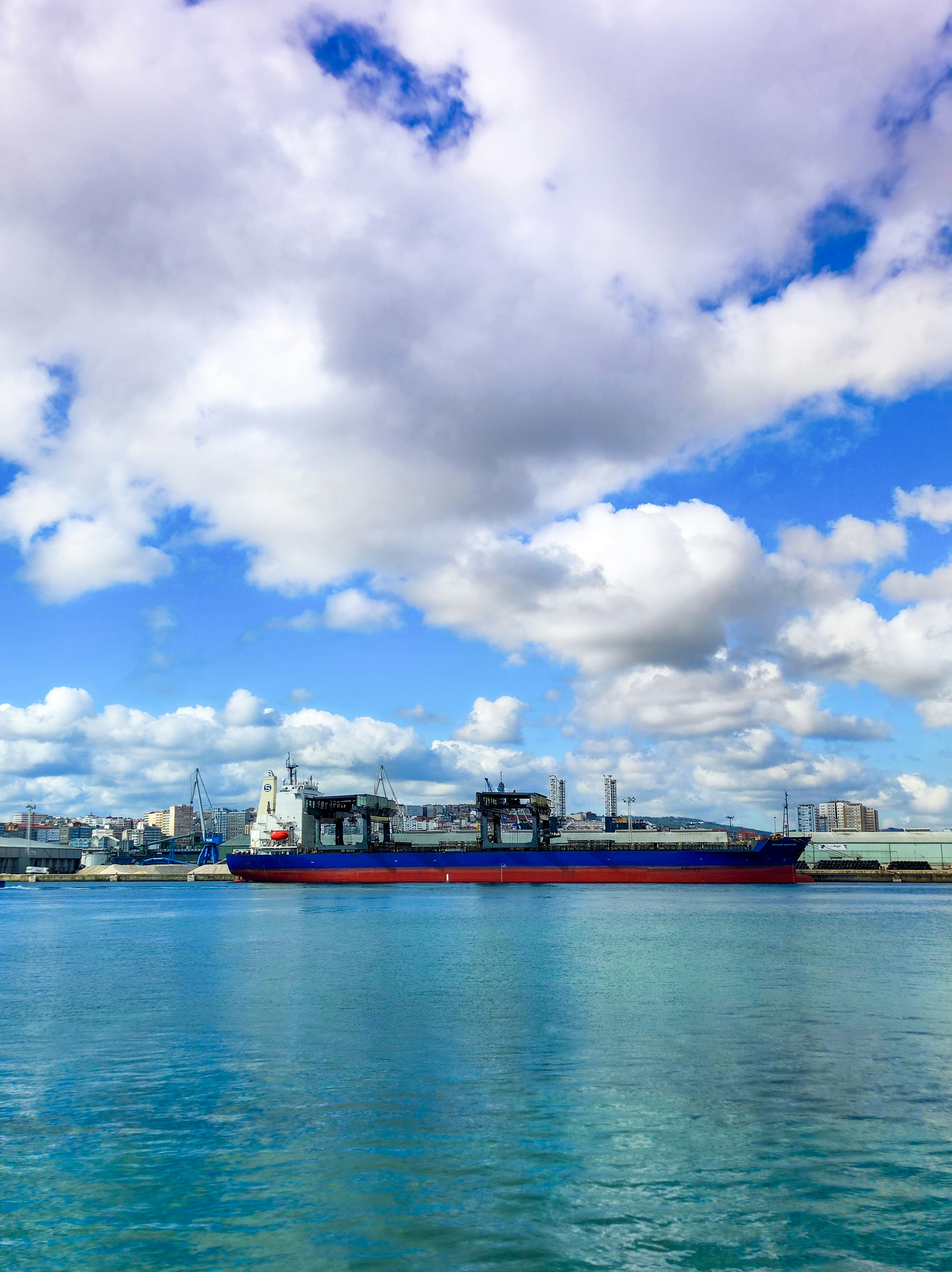 A large boat floating on top of a large body of water