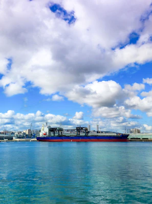 A large boat floating on top of a large body of water
