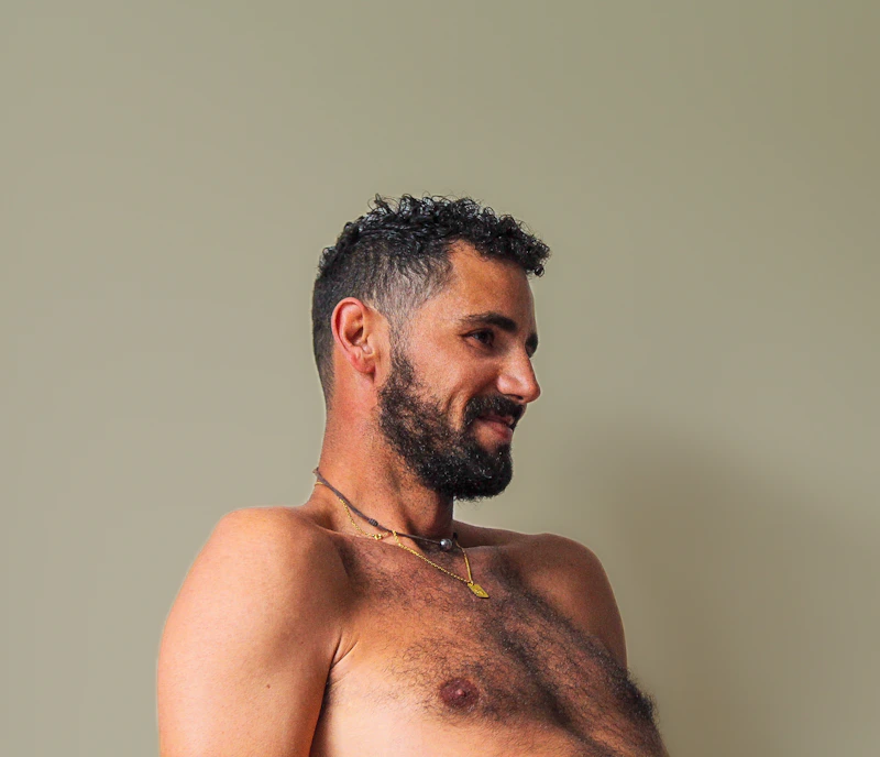 Attractive shirtless man in India, confident and looking for luxury