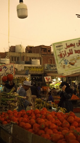 An outdoor market with lots of fruit and vegetables