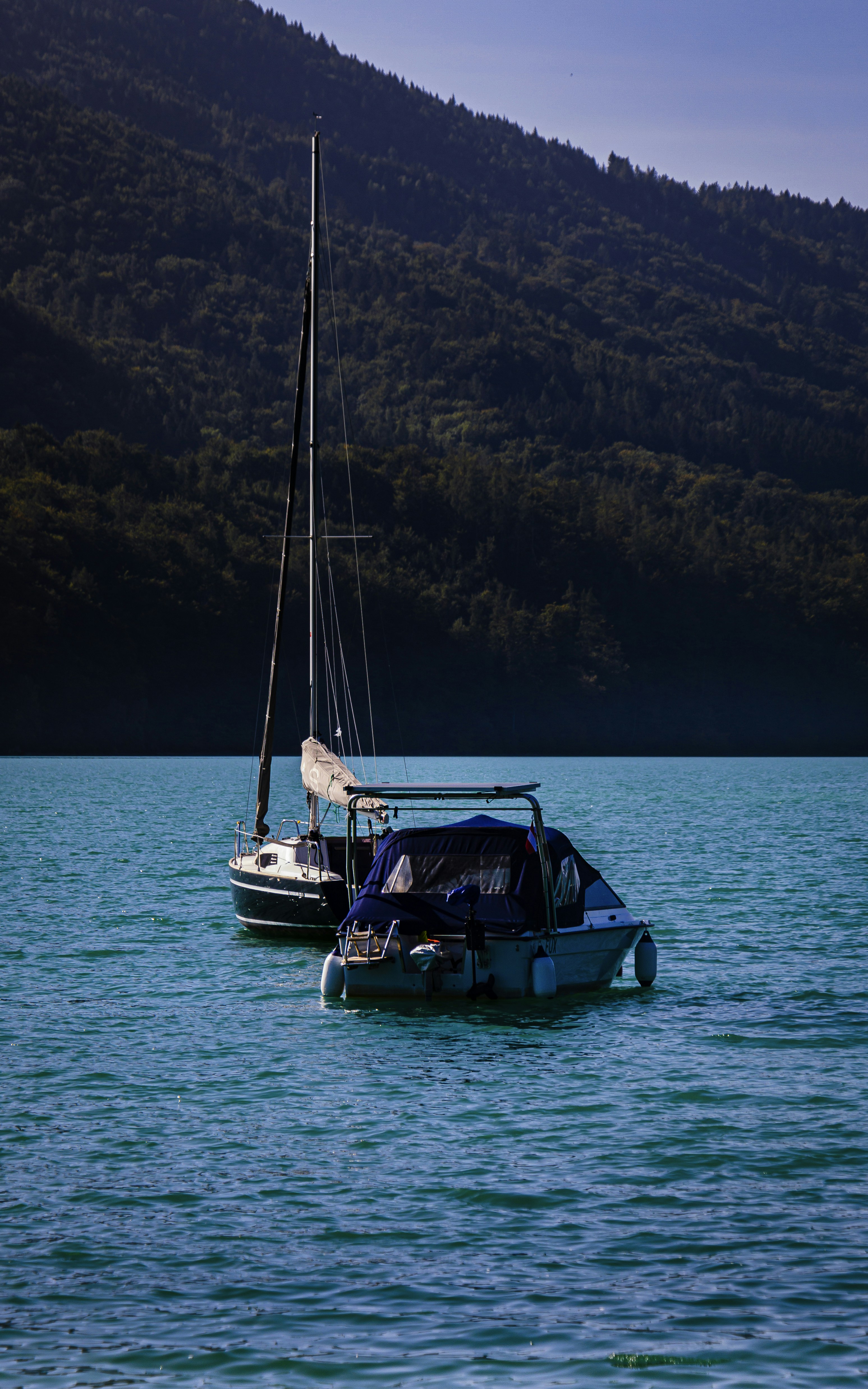 A boat floating on top of a large body of water