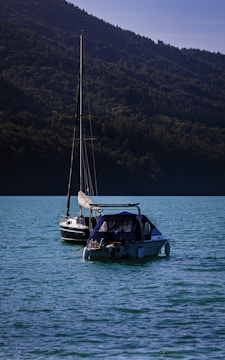 A boat floating on top of a large body of water