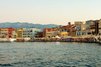 A body of water with a bunch of buildings in the background