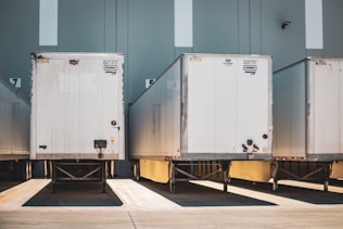 A row of semi trucks parked next to each other