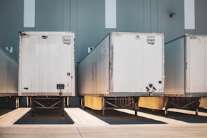 A row of semi trucks parked next to each other