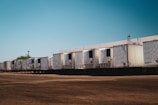 A row of semi trucks parked next to each other