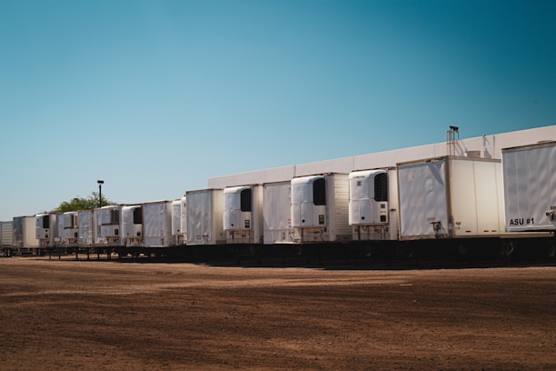 A row of semi trucks parked next to each other