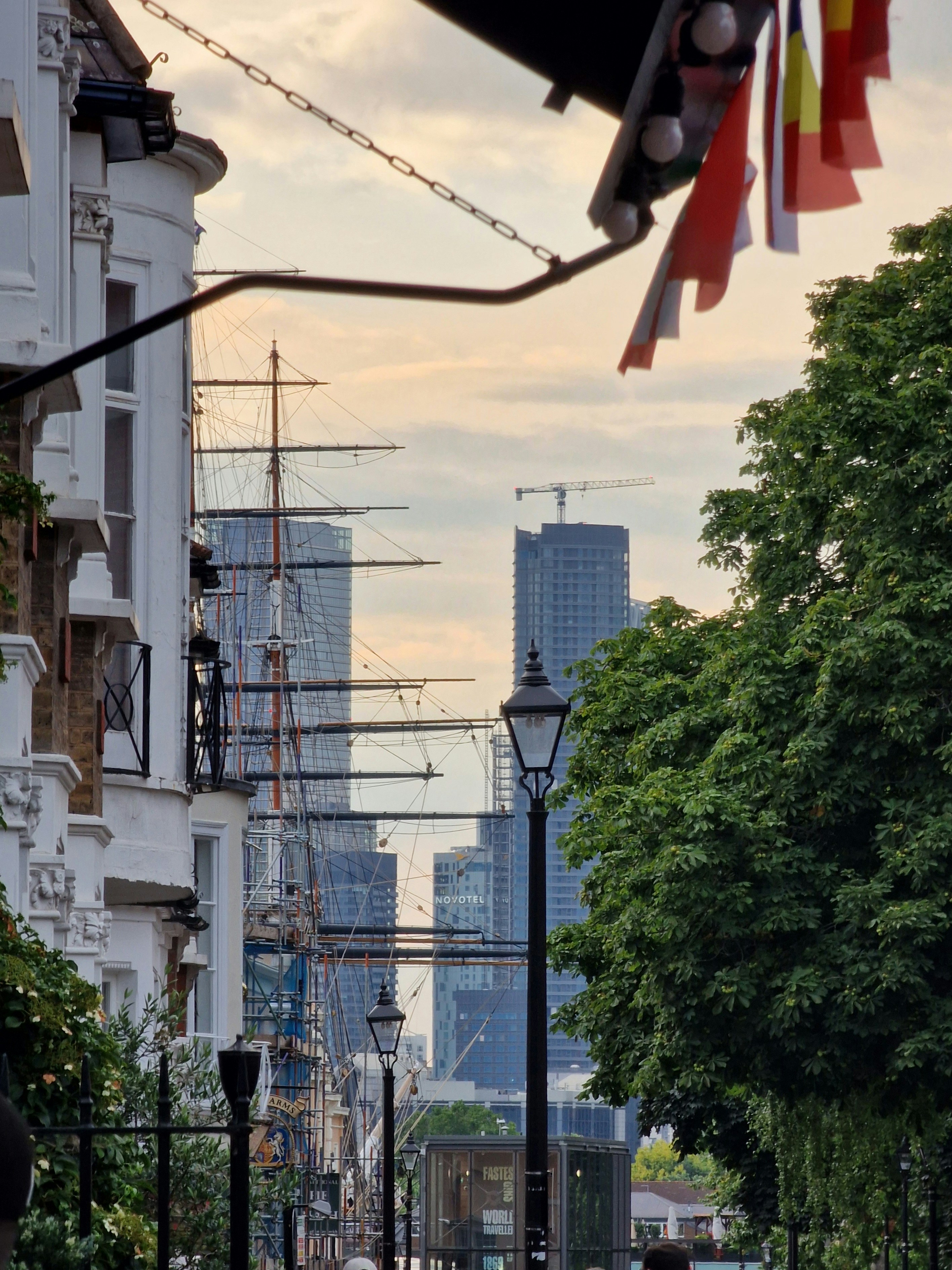 A view of a city street with tall buildings in the background