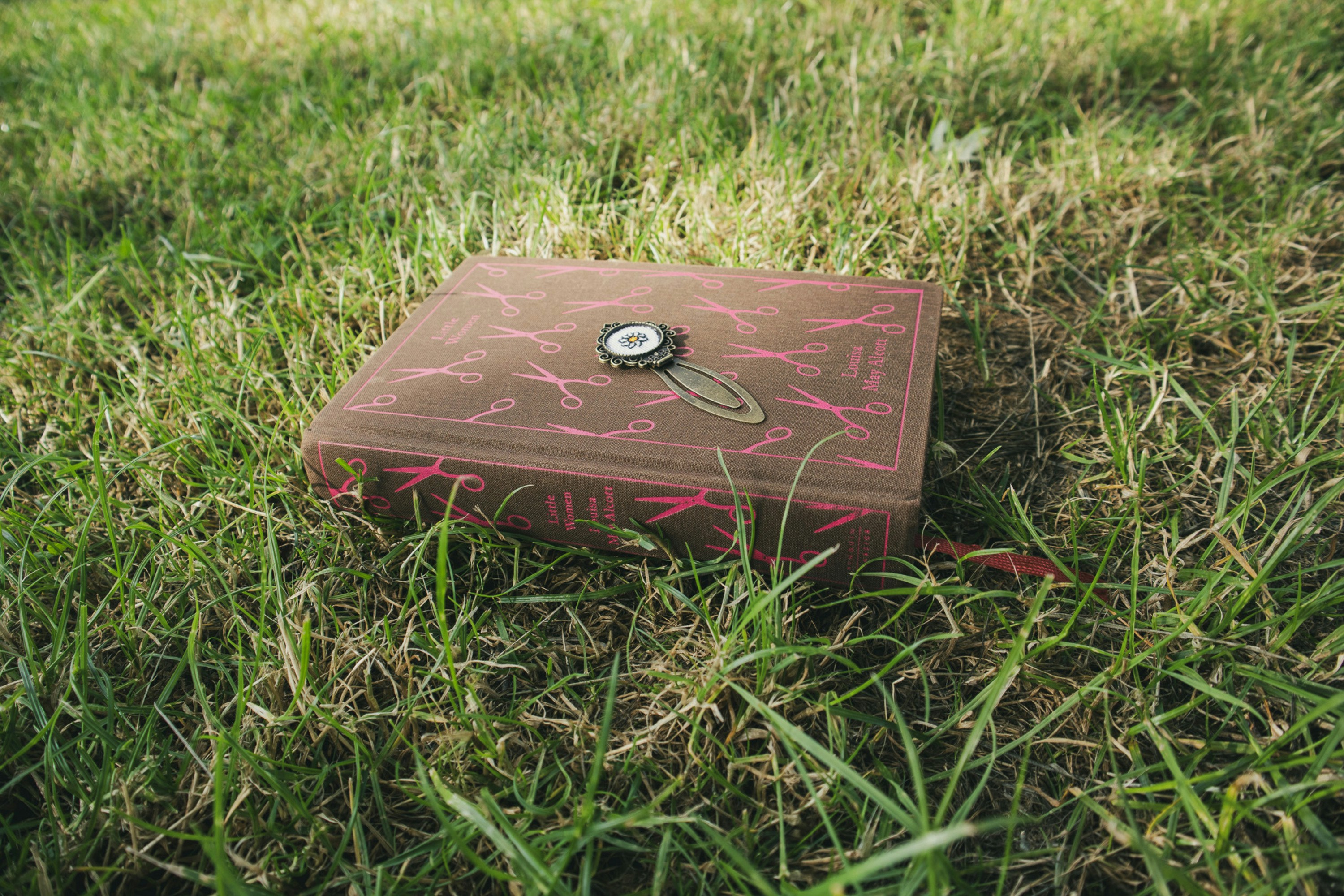 A hand opening a luxury black box with a smooth magnetic closure.