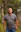 A man standing in the middle of a forest