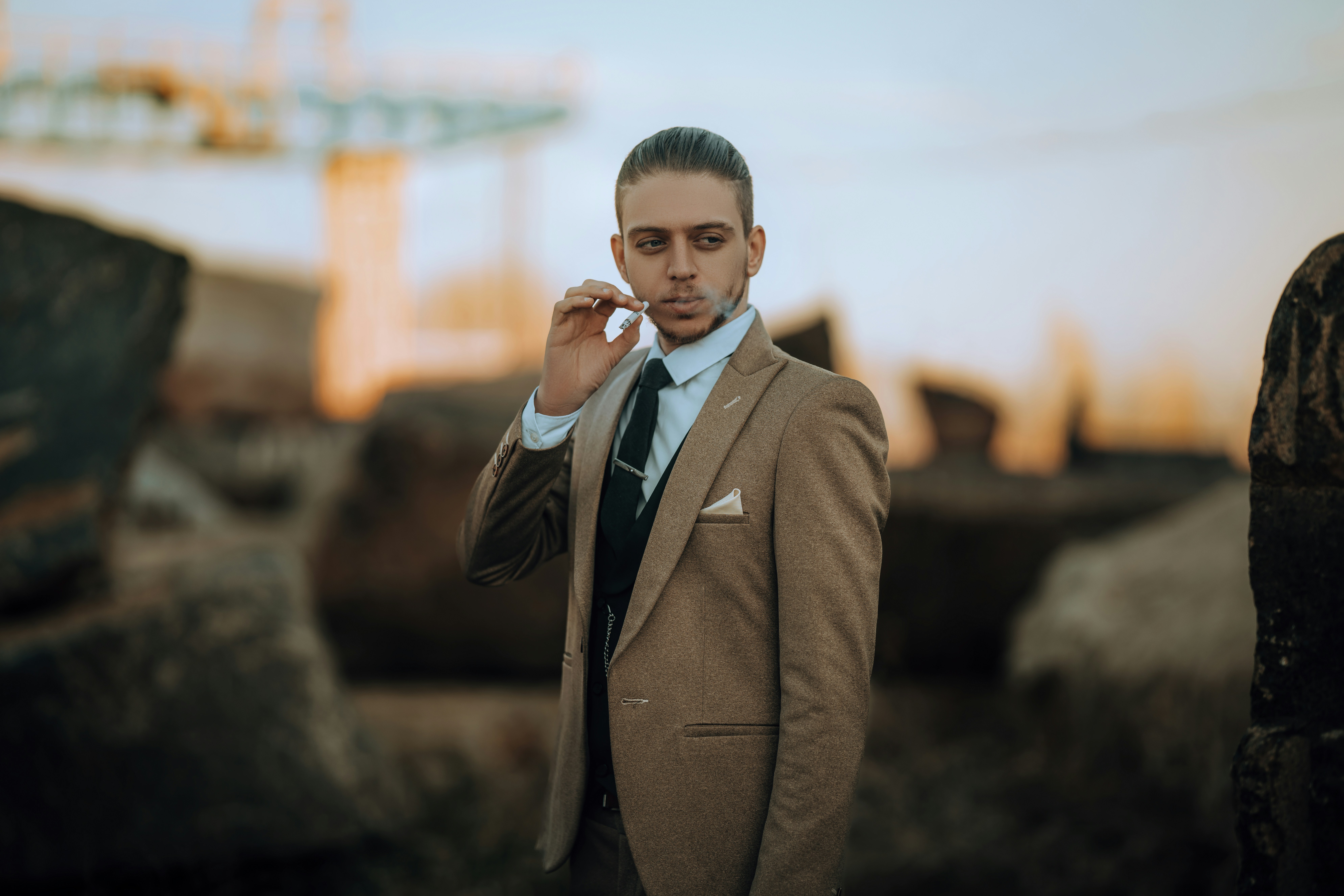 A man in a suit talking on a cell phone