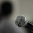 A close up of a microphone with a blurry background