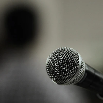A close up of a microphone with a blurry background