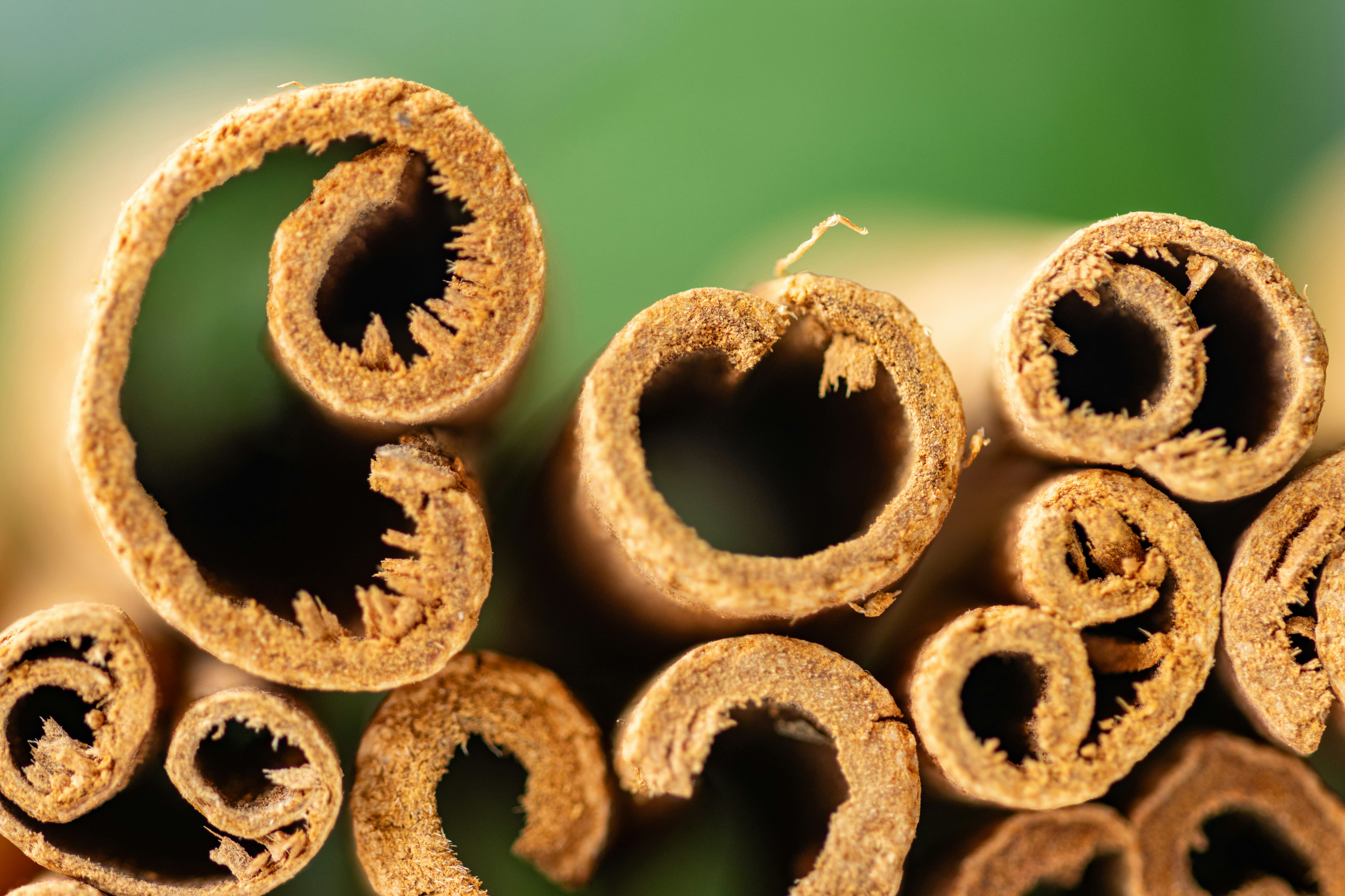 A pile of cinnamon sticks sitting on top of a table