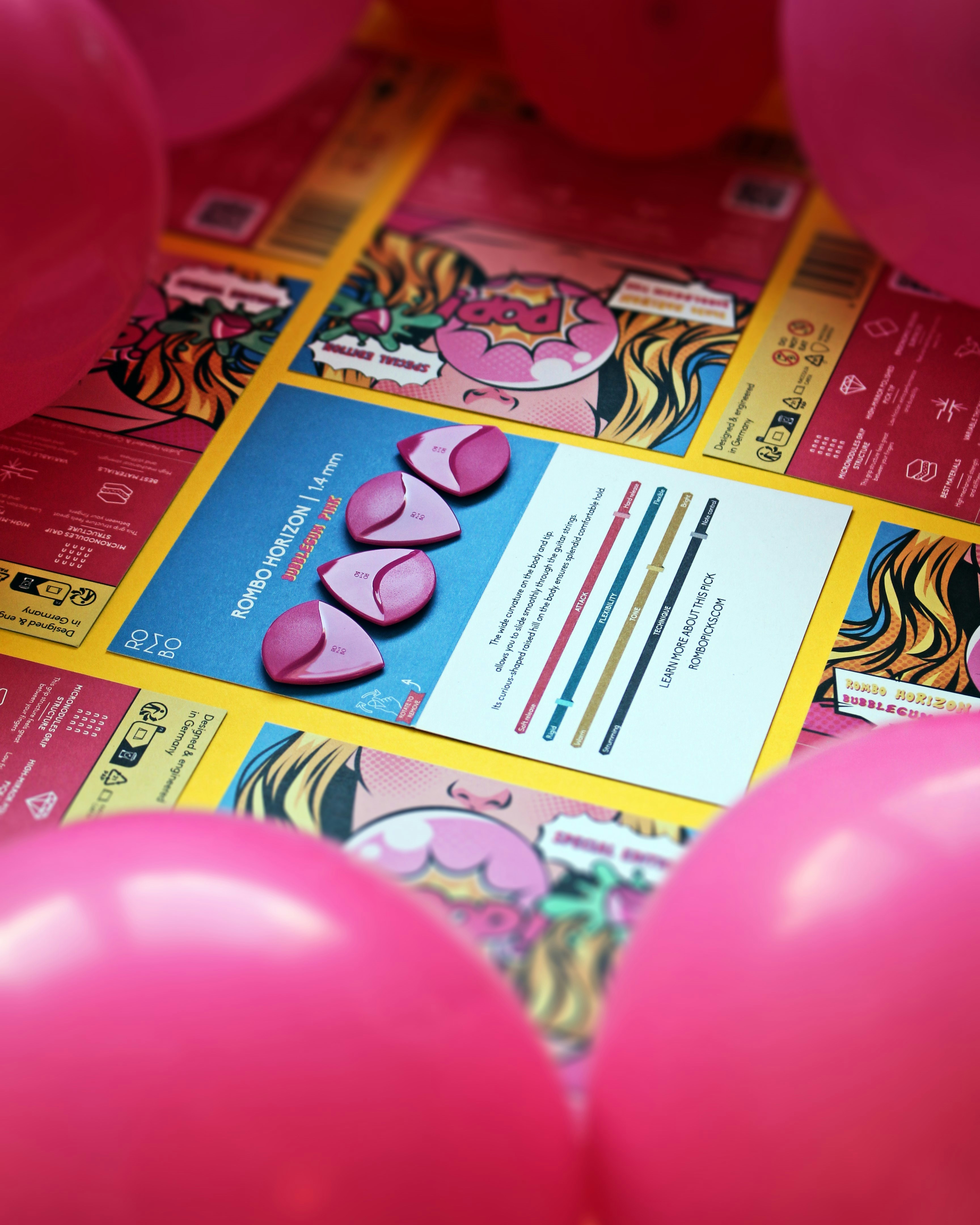 A bunch of pink balloons sitting on top of a table