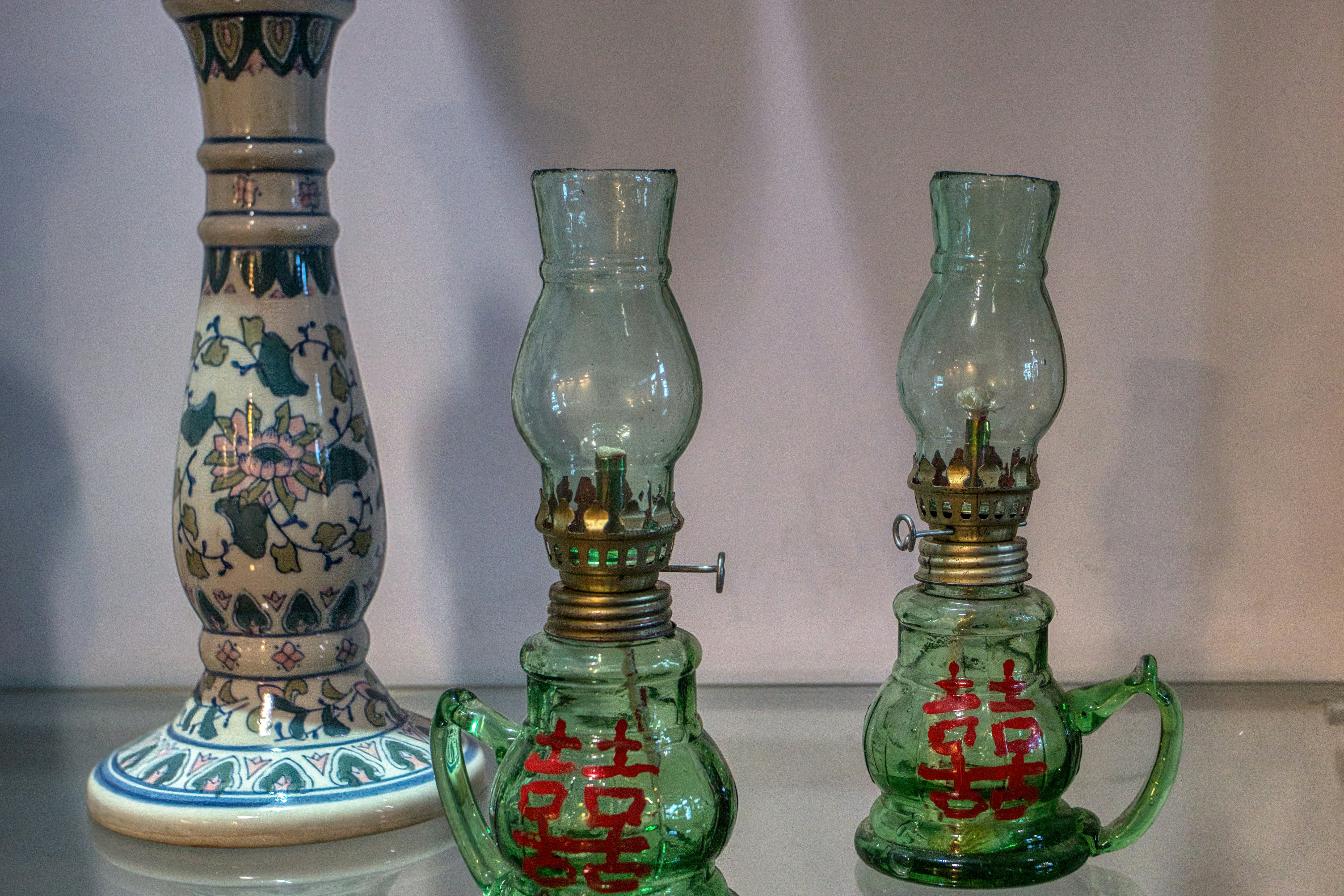 A group of three glass vases sitting on top of a table photo – Free ...